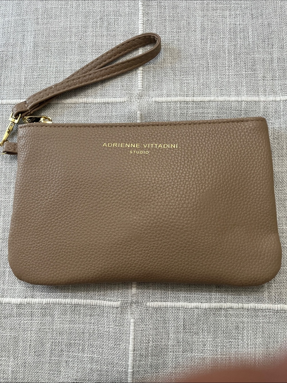 Adrienne Vittadini Taupe Pebbled faux leather Wristlet with chargers